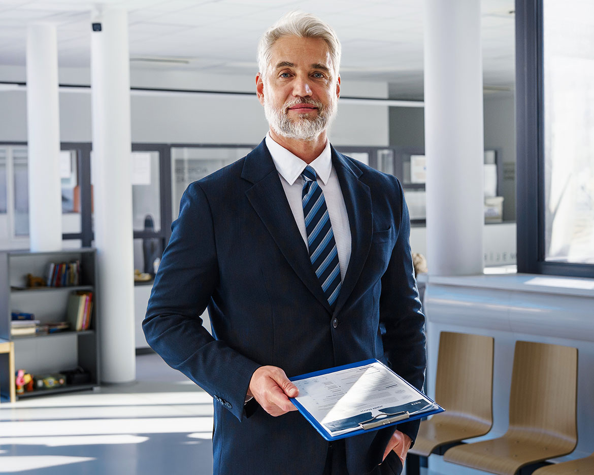 Exec with Clipboard https://talentquestor.solutions/wp-content/uploads/2026/05/Exec-with-Clipboard.jpg